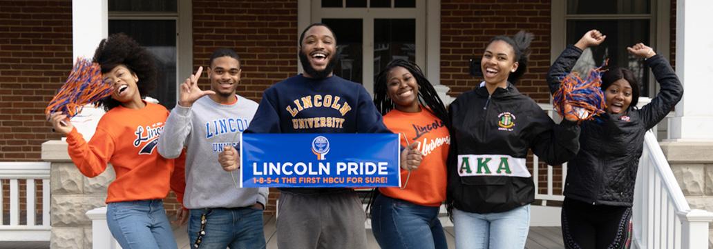 Group of students holding Lincoln Pride Banner