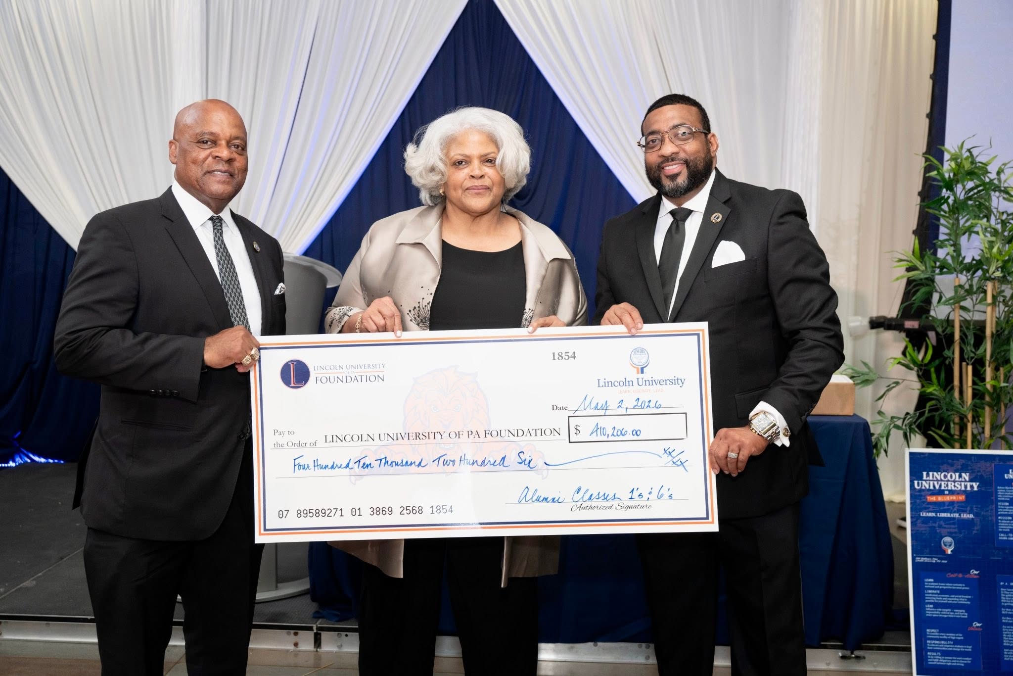 Dr. Allen, Van Corbin and Harry with Presenting Check