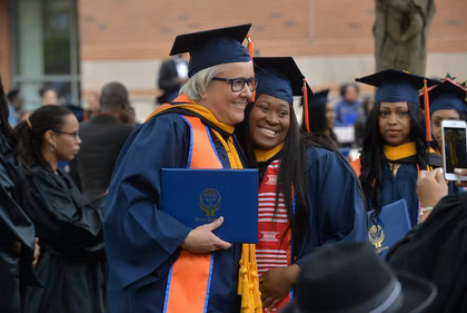 Student and professor at graduation