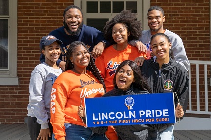 students holding lincoln pride sign
