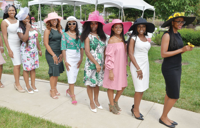 Students participating in the Parade of Hats competition